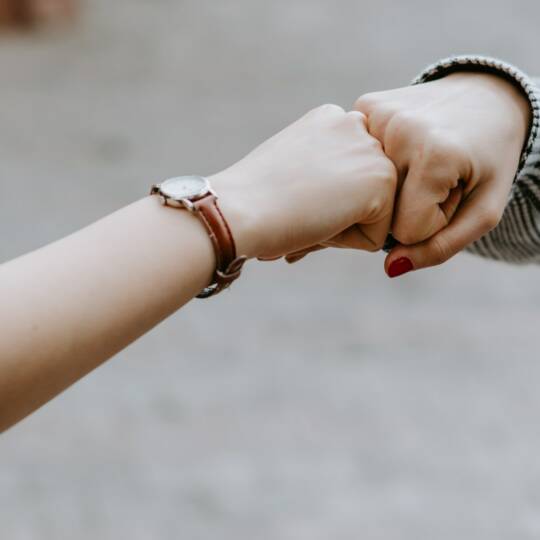 ashkan-forouzani-unsplash-check-two-fists-facing